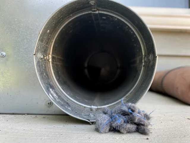 Lawndale Dryer Vent Cleaning technician using specialized equipment to clear severe dryer vent blockage in Lawndale